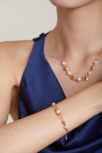 Layered molten gold necklace with matching earrings and bracelet