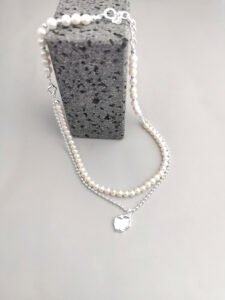 Layered pearl and silver beaded chain with lake pendant