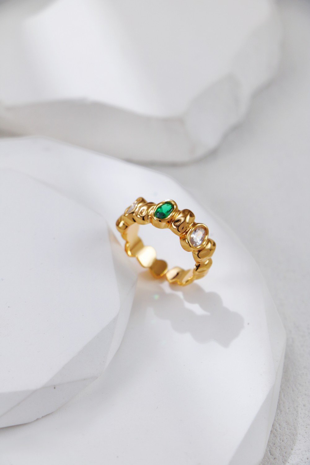 S925 adjustable silver and gold band rings inlaid with green and clear zircon on white background