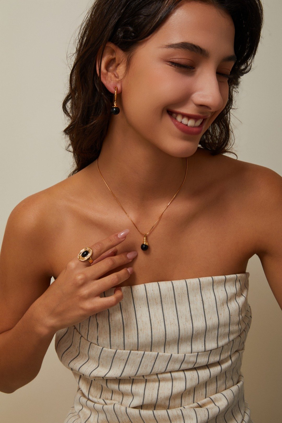 S925 black agate necklaces with silver and gold chains on a white stone background