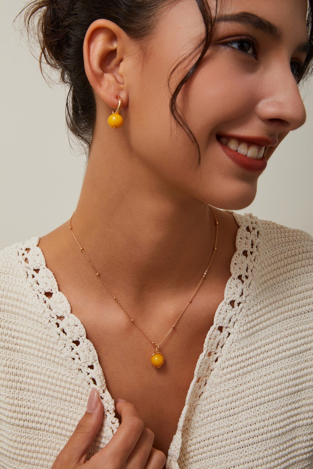 S925 vintage gold necklace with beeswax-like yellow pendant on white background